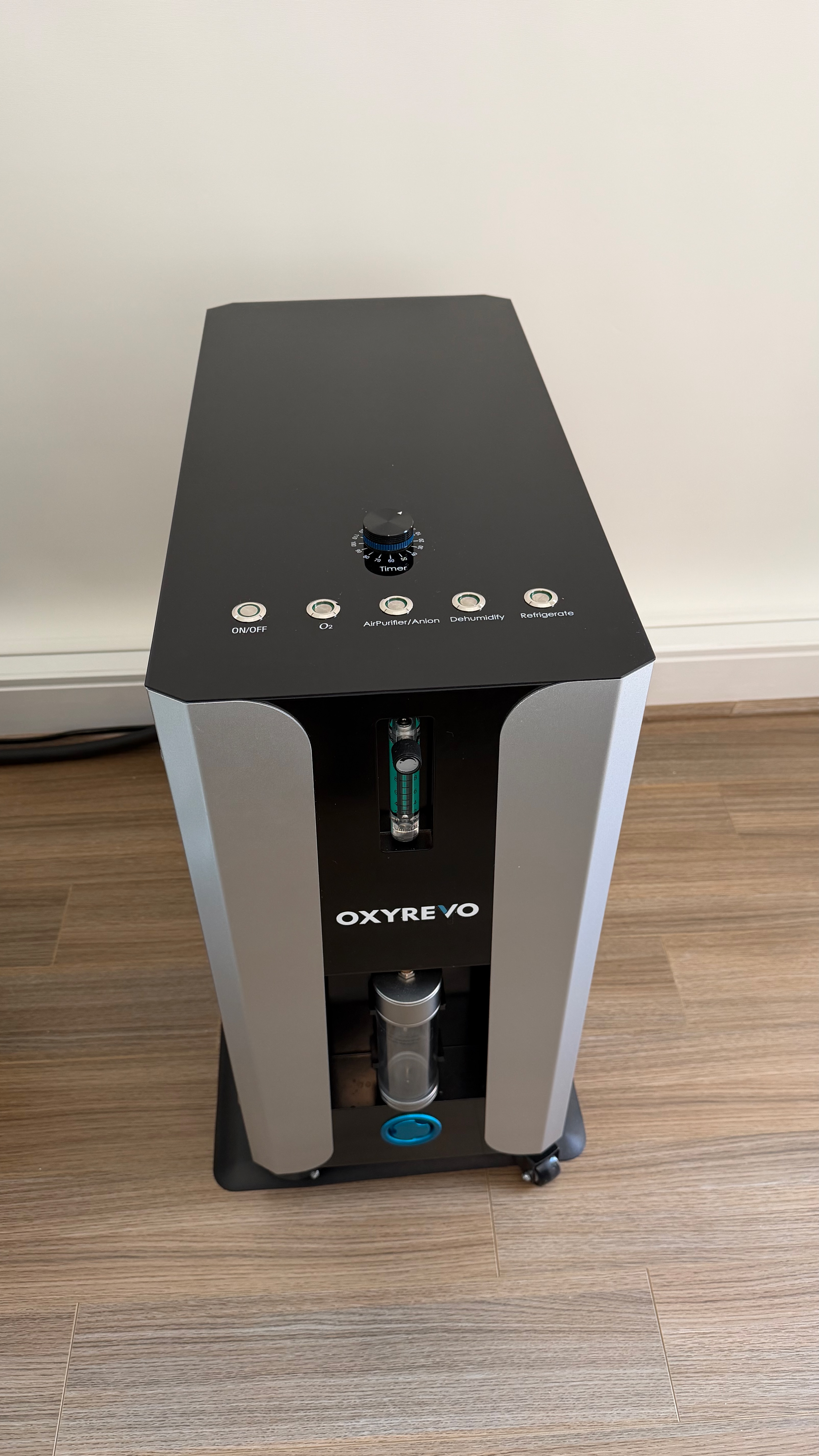 Used hyperbaric chamber Atlanta — OXYREVO Forward90 Pro Version operating unit top control panel showing one-press On/Off, O2, Air Purifier/Anion, Dehumidify, Refrigerate and Timer controls with oxygen flow meter and water humidifier. Actual unit, Buckhead Atlanta GA.